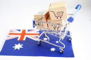 compras on-line, caixa de carrinho de compras na bandeira da austrália, importação e exportação, comércio financeiro. foto