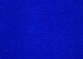 elegante azul desigual textura fundo do frustrar, papel, tela, parede, escovar, fibra, ou pintar. realista azul abstrato fundo. artístico azul abstrato fundo. para azul fundo textura. foto