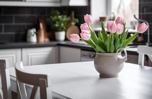 ai gerado branco toalha de mesa em Preto chão dentro cozinha com Rosa tulipas em mesa foto