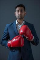 ai gerado uma homem de negocios vestindo boxe luvas em azul fundo, trabalho dia Projeto foto