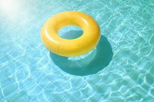 ai gerado verão amarelo natação piscina anel flutuador dentro azul água. criada com generativo ai foto