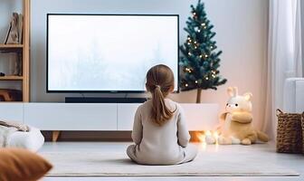 ai gerado uma curioso pequeno menina hipnotizado de a televisão tela foto