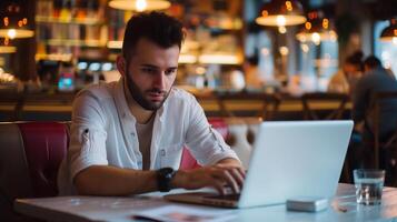 ai gerado digital nômade jovem homem usando computador portátil computador às a cafeteria, trabalhando controlo remoto e tecnologia conceito foto