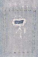 jeans tecido Como uma fundo. macro foto do a item do roupas, jeans com uma correção.