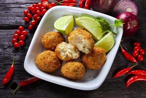 bacalhau bolinho de massa, sal bacalhau bolinhos fritos, Bunuelos de bacalhau foto