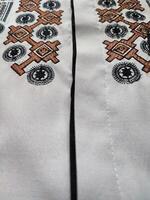 lindo árabe texturas e padrões em muçulmano roupas foto