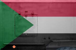 Sudão bandeira retratado em lado parte do militares blindado caminhão fechar-se. exército forças conceptual fundo foto