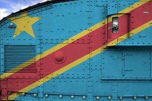 democrático república do a Congo bandeira retratado em lado parte do militares blindado tanque fechar-se. exército forças conceptual fundo foto