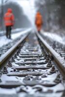 ai gerado inverno estrada de ferro inspeção, focado Visão em faixas com borrado fundo do Ferrovia trabalhadores dentro Alto visibilidade roupas inspecionando a local foto