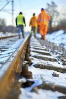 ai gerado inverno estrada de ferro inspeção, focado Visão em faixas com borrado fundo do Ferrovia trabalhadores dentro Alto visibilidade roupas inspecionando a local foto