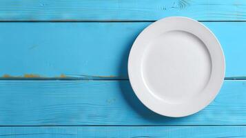 ai gerado branco esvaziar prato em azul de madeira mesa topo Visão foto