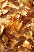 ai gerado dourado perfume garrafa cercado de espumante brilhar e metálico folhas foto