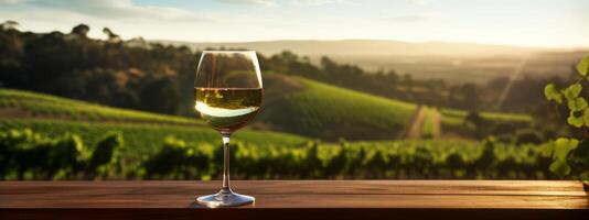 ai gerado uma vidro do branco vinho sentado em uma mesa dentro frente do vinhas foto