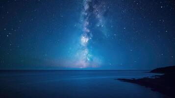 ai gerado leitoso caminho galáxia sobre a oceano com rochoso litoral dentro a primeiro plano foto