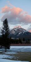 ai gerado pôr do sol sobre Nevado picos foto