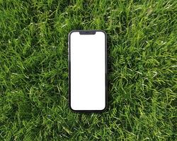 ai gerado moderno Smartphone brincar cena. Smartphone brincar modelo com em branco branco tela em verde grama. foto