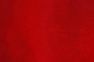 brilhante vermelho camurça textura Como uma fundo. foto