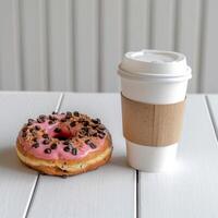 ai gerado lá é uma cartão café copo e 1 rosquinha em a mesa foto