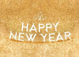 feliz ano novo palavra em fundo brilhante glitter dourados foto
