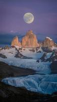 ai gerado nascer da lua sobre Patagônias céu encanta com etéreo beleza vertical Móvel papel de parede foto