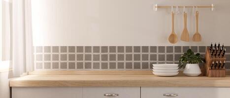 uma minimalista de madeira cozinha bancada com utensílios de cozinha dentro uma contemporâneo minimalista cozinha. foto