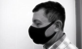 digital Preto e branco pintura estilo este retrata a face do uma homem com uma Preto protetora anti-contágio mascarar foto