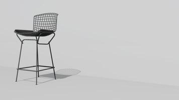 uma branco cadeira com uma Preto almofada senta em uma branco parede foto