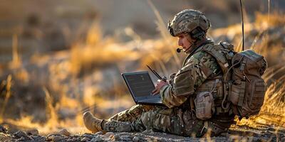 ai gerado concentrado jovem programador soldado sentado em terra e trabalhando com computador portátil enquanto analisando exército rota foto