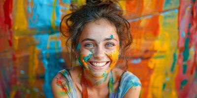 ai gerado delicioso jovem menina com encaracolado cabelo e face manchado com vibrante pintura cores, sorridente brilhantemente dentro frente do uma colorida pano de fundo foto