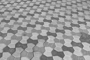 a textura do uma pedra velho calçada com uma perspectiva. Preto e branco. foto