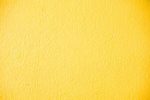 vibrante texturas, amarelo concreto parede fundos. foto