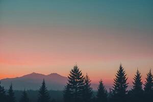 montanhas e árvores às pôr do sol com uma Rosa céu foto