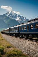 ai gerado uma azul trem viajando através a campo com montanhas dentro a fundo foto