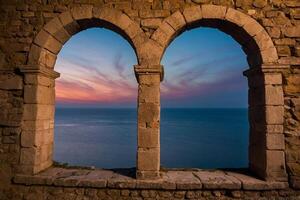 pôr do sol através a arco dentro a velho pedra construção foto