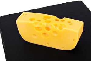 queijo suíço em fundo preto foto