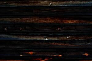 Sombrio de madeira fundo quase Preto. queimado de madeira superfície. foto