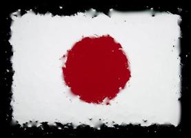 gotas de água no fundo da bandeira do japão. profundidade superficial de campo. foco seletivo. tonificado. foto