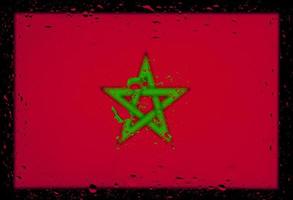 gotas de água no fundo da bandeira de Marrocos. profundidade superficial de campo. foco seletivo. tonificado. foto