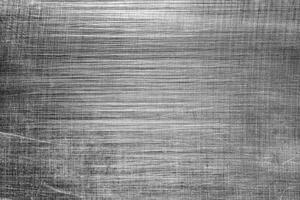 monocromático textura do brilhante arranhado metal. abstrato fundo. foto