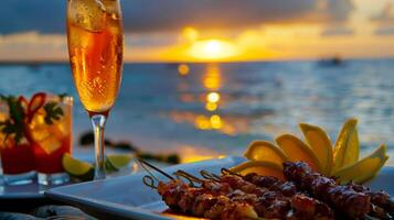 uma romântico pôr do sol piquenique em uma caribe de praia com tropical coquetéis y linguiça espetos e fogosa camarão tacos foto