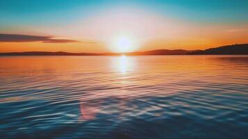pôr do sol sobre tranquilo lago, fundição caloroso brilho sobre a água e em torno da panorama foto