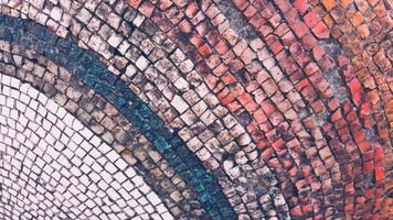 mosaico antigo multicolorido de pequenas pedras foto