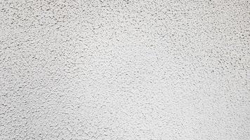 textura da parede de concreto. fundo de parede de estuque branco. parede de cimento pintada de branco. parede de concreto branco e piso como textura de fundo. loft no estilo de idéias de design de um edifício residencial. foto