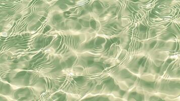 uma textura do ondulações em areia, com pequeno ondas em a superfície, luz verde matiz. foto