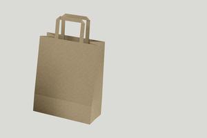 close-up vista da sacola de compras de papel ofício com alças em fundo branco, ilustração isolada de renderização 3D. adequado para o seu design de elemento. foto