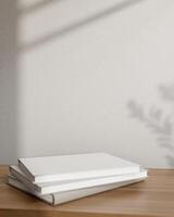 livros em uma de madeira mesa contra a cinzento parede com luz do dia sombra. pedestal para exibindo produtos foto