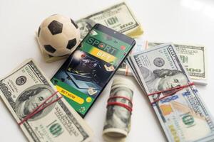 futebol bola sobre uma muitos do dinheiro. corrupção futebol jogo. apostando e jogos de azar conceito. wold copo foto