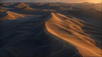 a aéreo Visão do uma areia duna dentro a deserto às pôr do sol foto