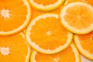 fundo de fruta laranja frescor fatiado. padrão redondo. foto