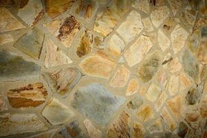 pedra parede textura fundo - cinzento pedra tapume com diferente tamanho pedras foto